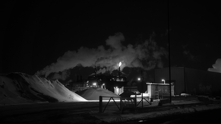 A flame from a steel mill in winter.